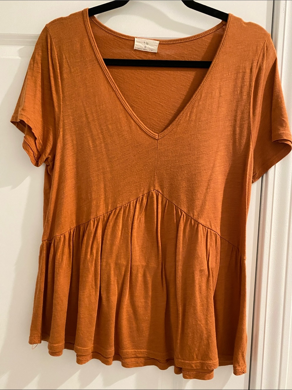T.La V-Neck Peplum Tunic in Burnt Orange